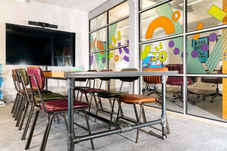 Shows colorful window graphics to help create privacy for a meeting room.